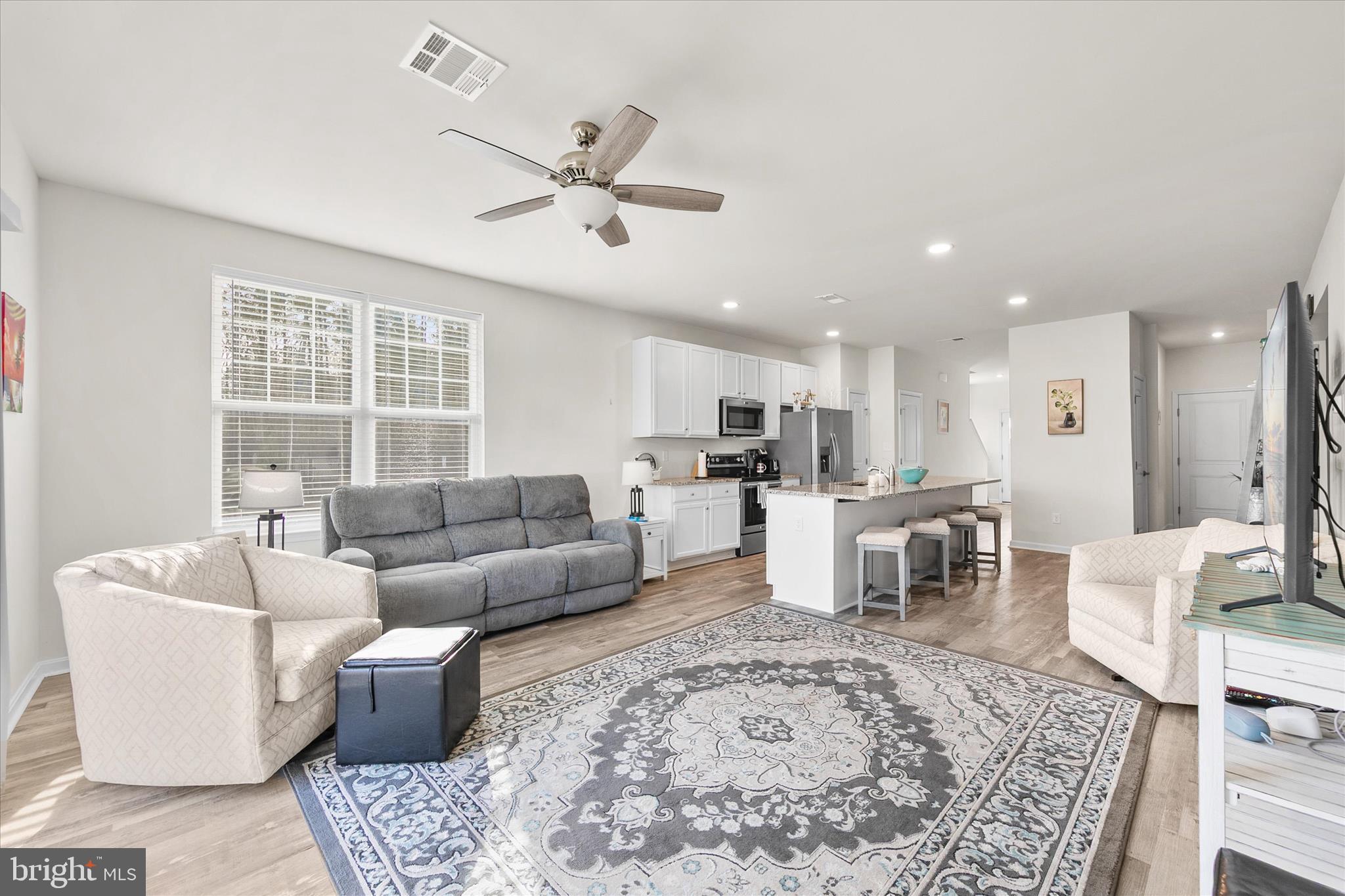 33204 Cross Road Frankford, DE 19945 - Photo 12 of 35 a living room with furniture and a large window