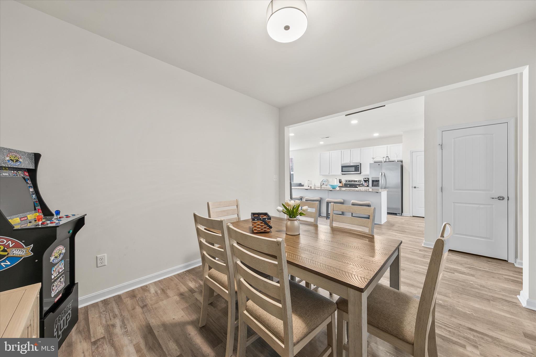33204 Cross Road Frankford, DE 19945 - Photo 14 of 35 a dining room with furniture and wooden floor