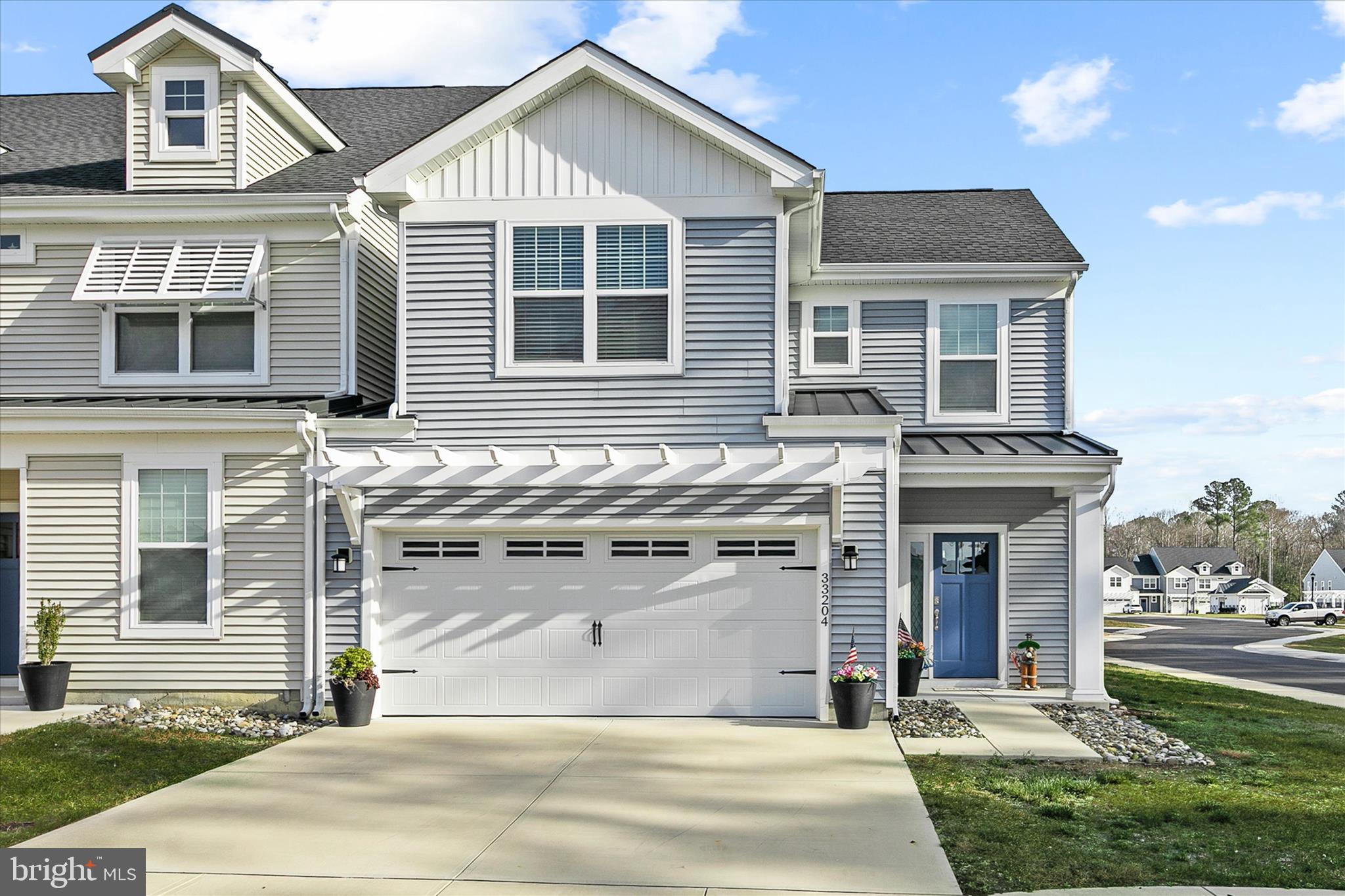 33204 Cross Road Frankford, DE 19945 - Photo 2 of 35 a front view of a house with a yard