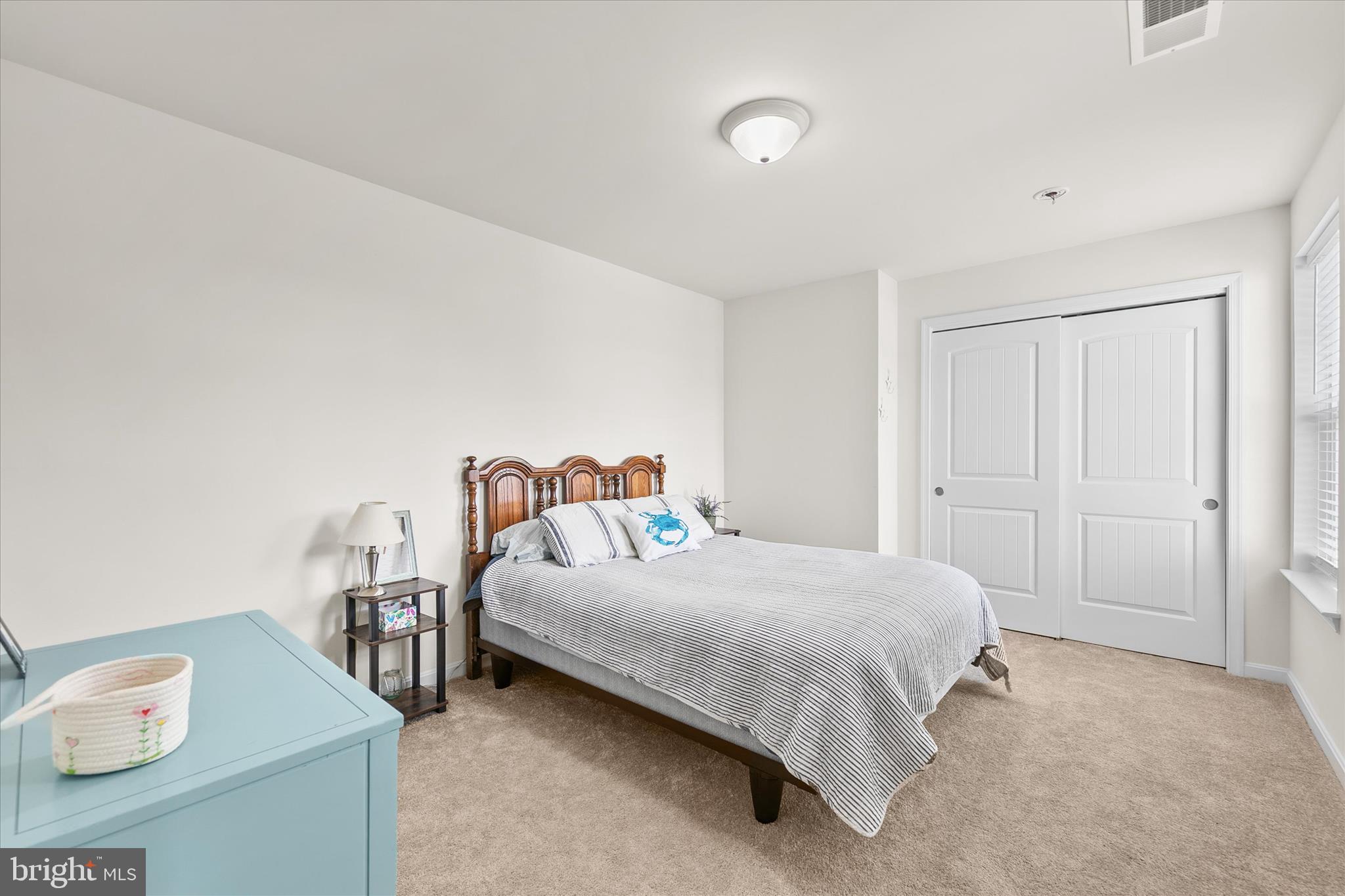 33204 Cross Road Frankford, DE 19945 - Photo 21 of 35 a bedroom with a bed and a window