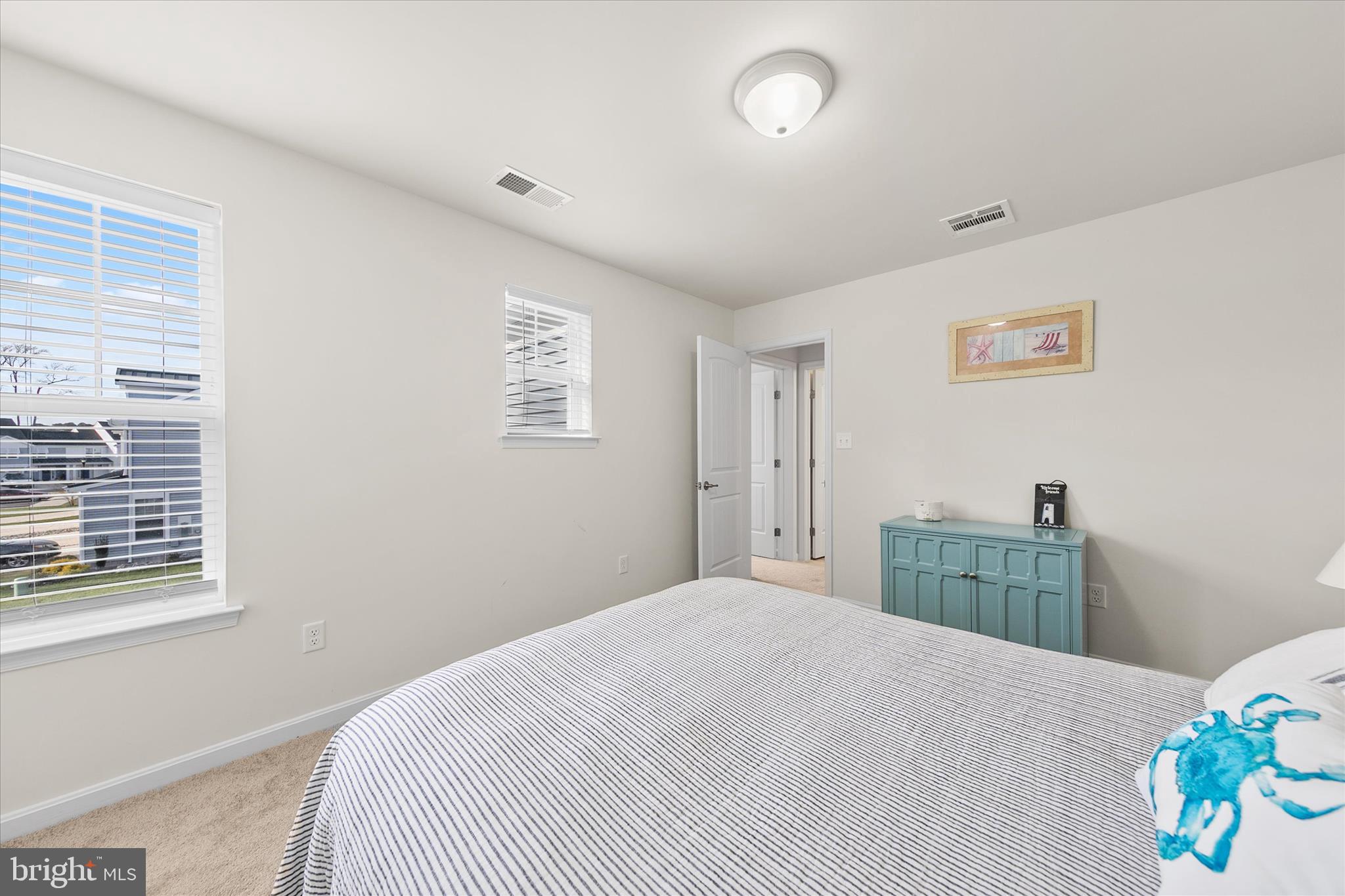 33204 Cross Road Frankford, DE 19945 - Photo 22 of 35 a bedroom with a bed and a window