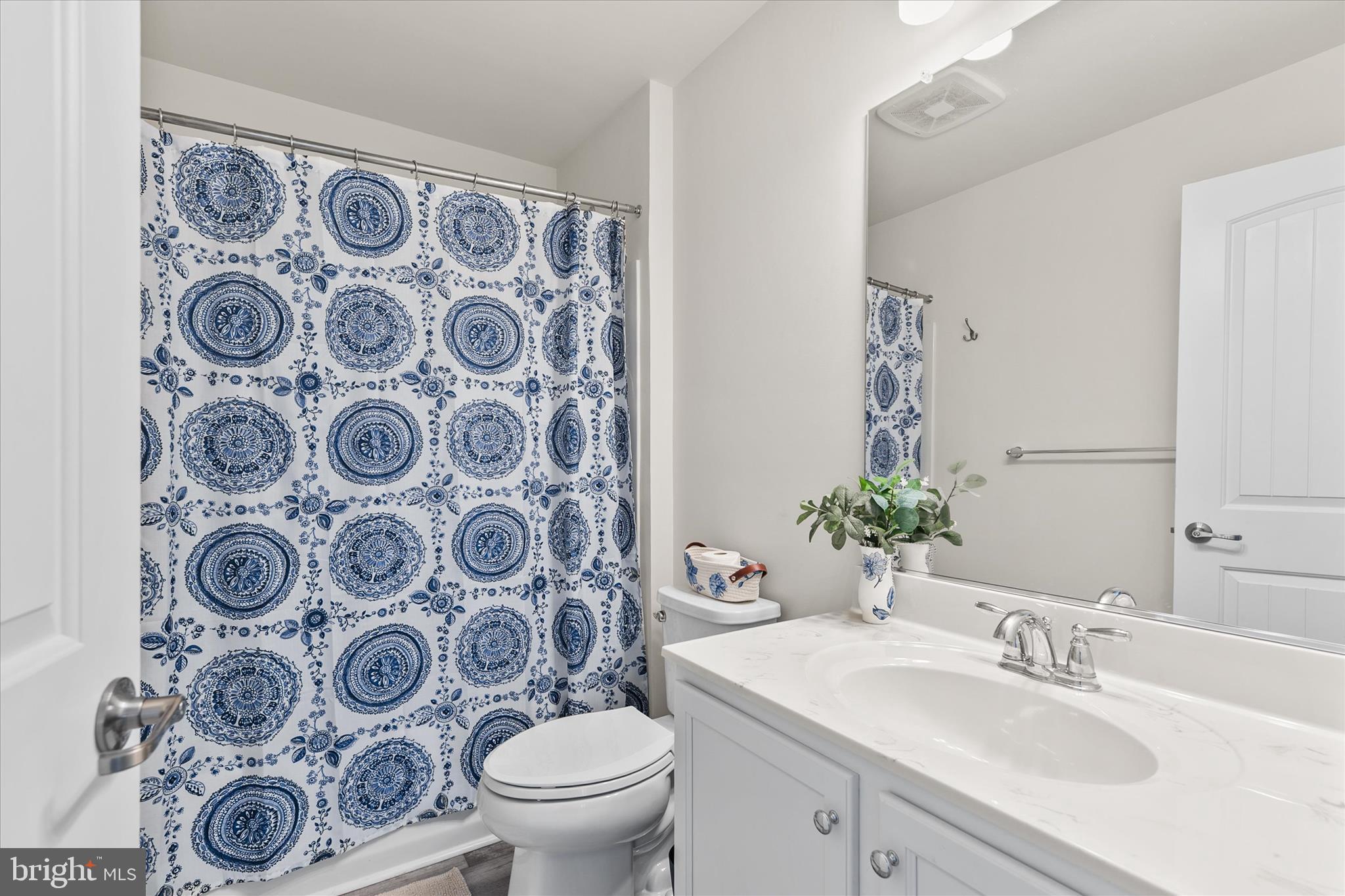 33204 Cross Road Frankford, DE 19945 - Photo 23 of 35 a bathroom with a sink and mirror with toilet
