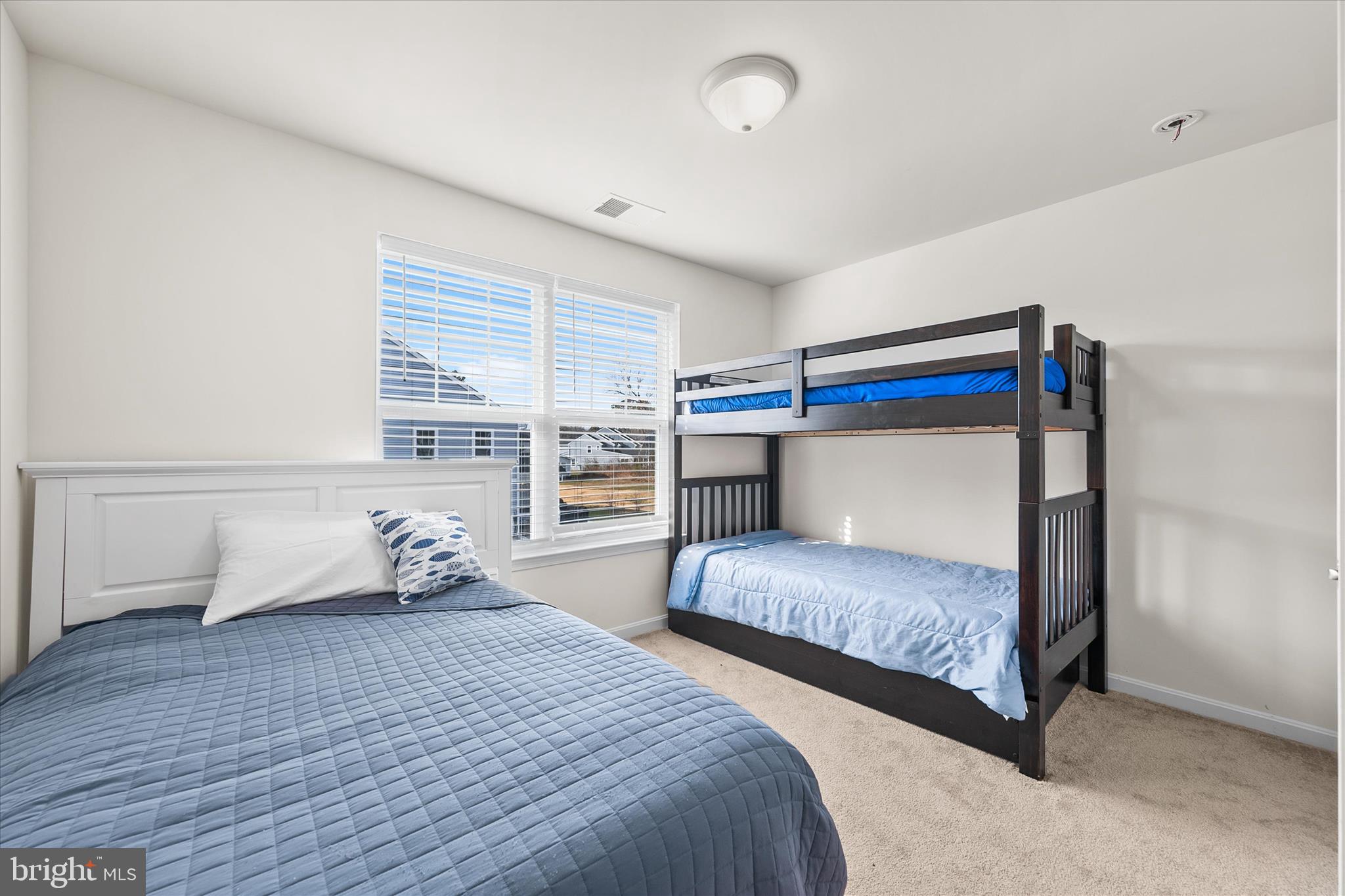 33204 Cross Road Frankford, DE 19945 - Photo 24 of 35 a bedroom with two beds and window