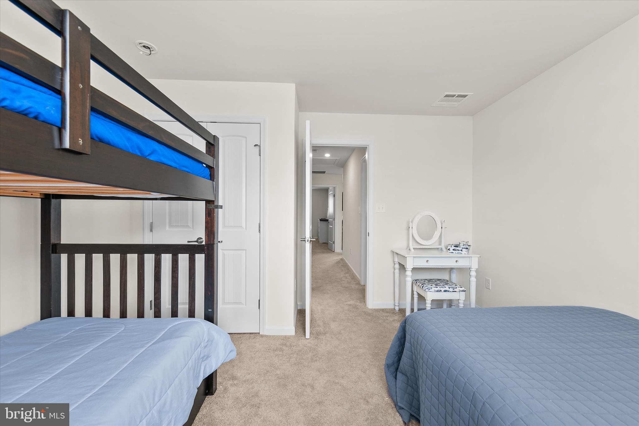 33204 Cross Road Frankford, DE 19945 - Photo 25 of 35 a bedroom with a bed and dresser