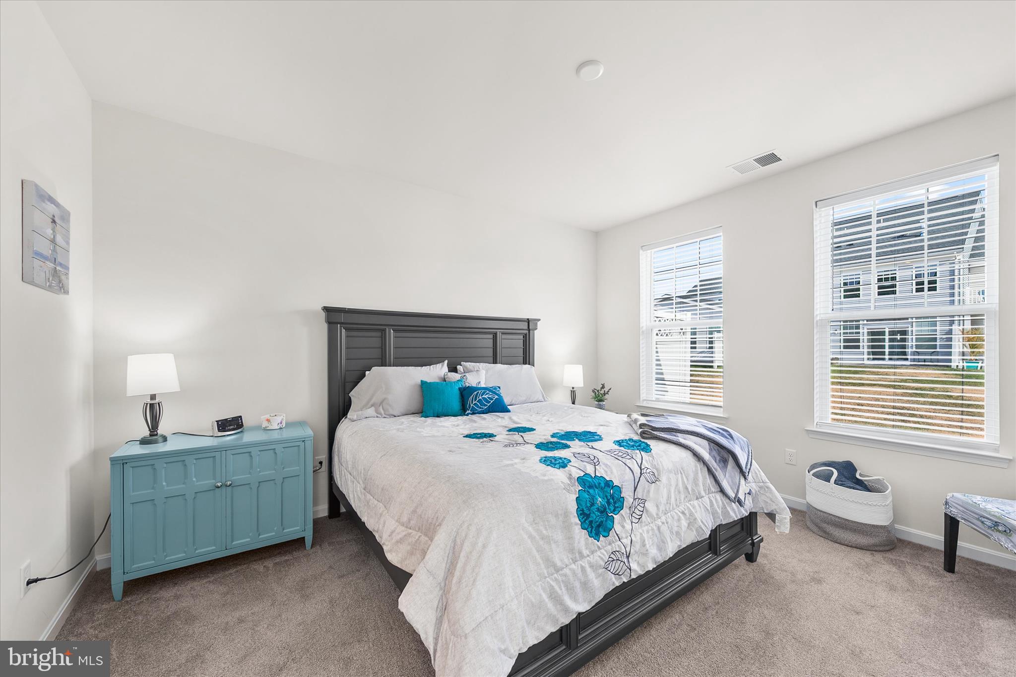 33204 Cross Road Frankford, DE 19945 - Photo 27 of 35 a bedroom with a bed a dresser and a window