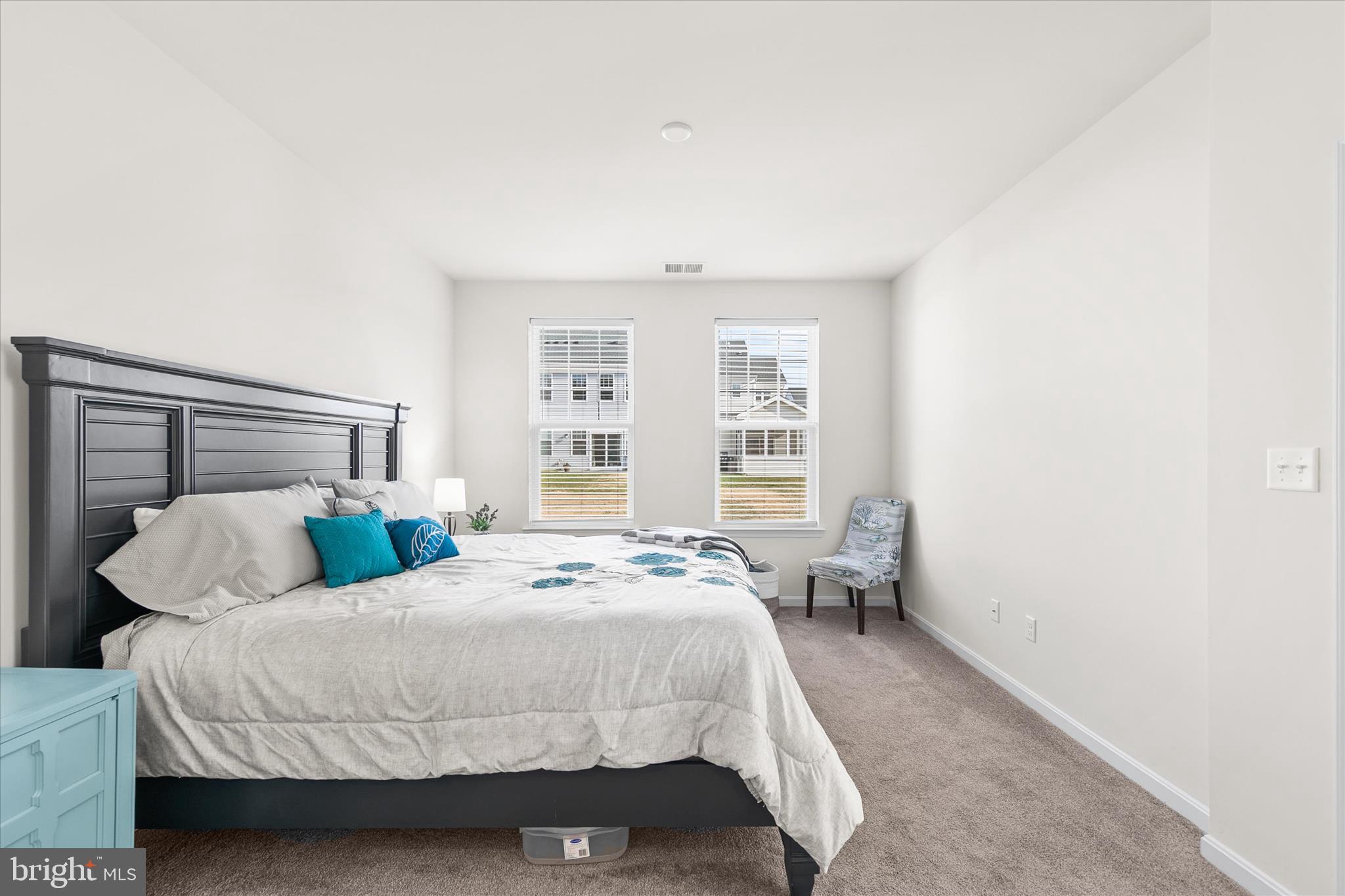33204 Cross Road Frankford, DE 19945 - Photo 29 of 35 a bedroom with a bed and chair