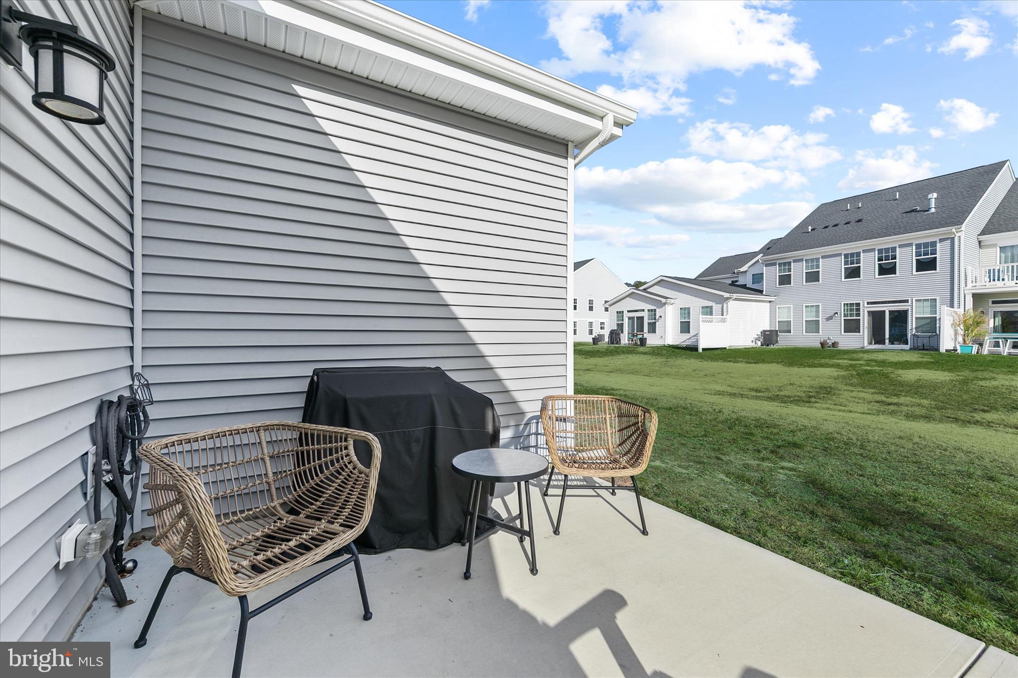 33204 Cross Road Frankford, DE 19945 - Photo 31 of 35 a backyard of a house with table and chairs