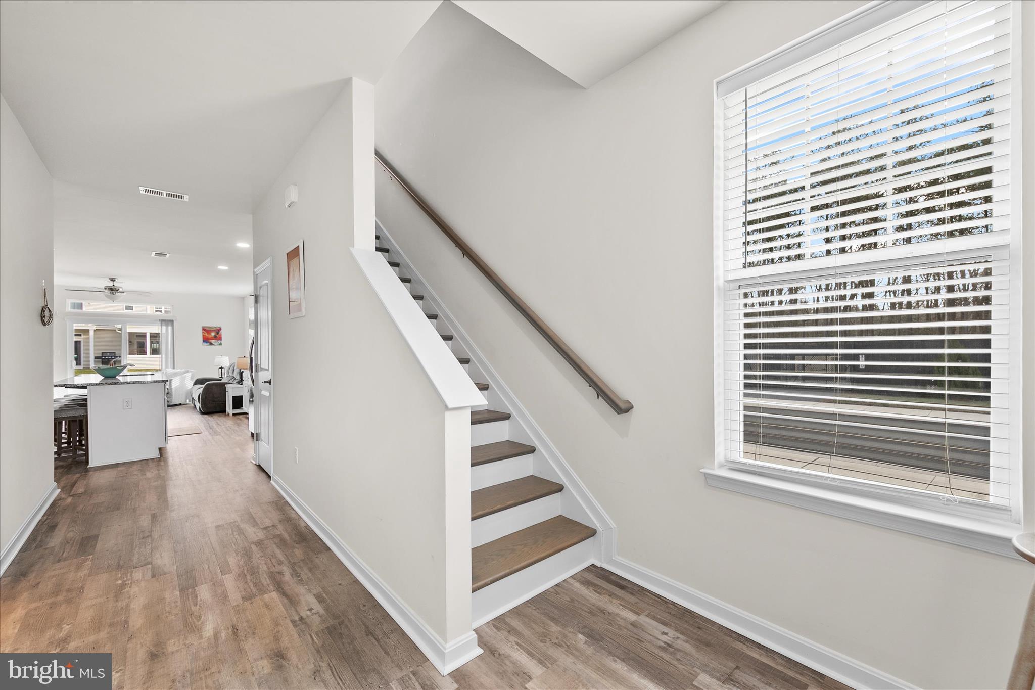 33204 Cross Road Frankford, DE 19945 - Photo 5 of 35 a view of a kitchen with furniture and wooden floor