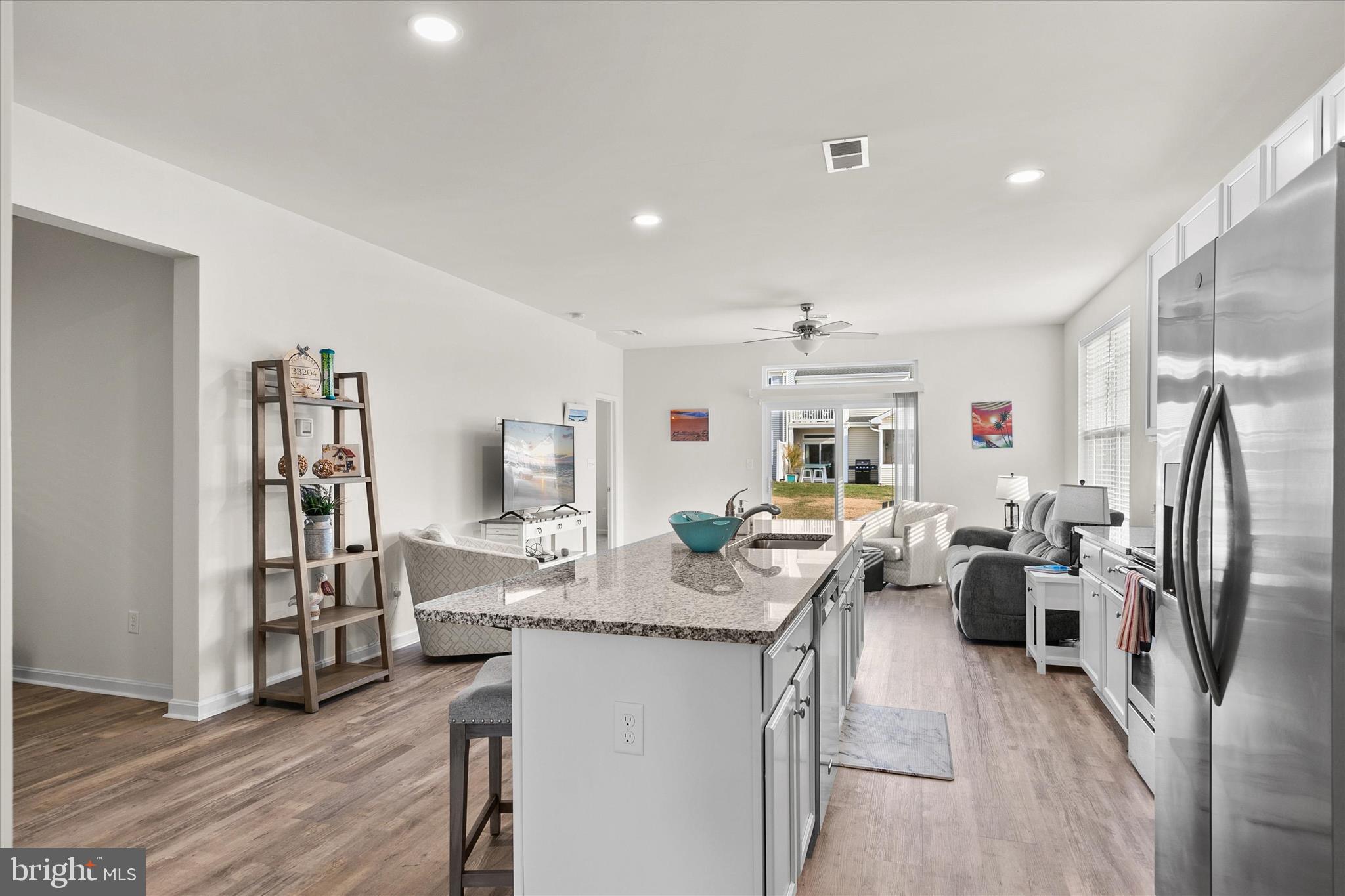 33204 Cross Road Frankford, DE 19945 - Photo 6 of 35 a living room with fireplace furniture and a wooden floor