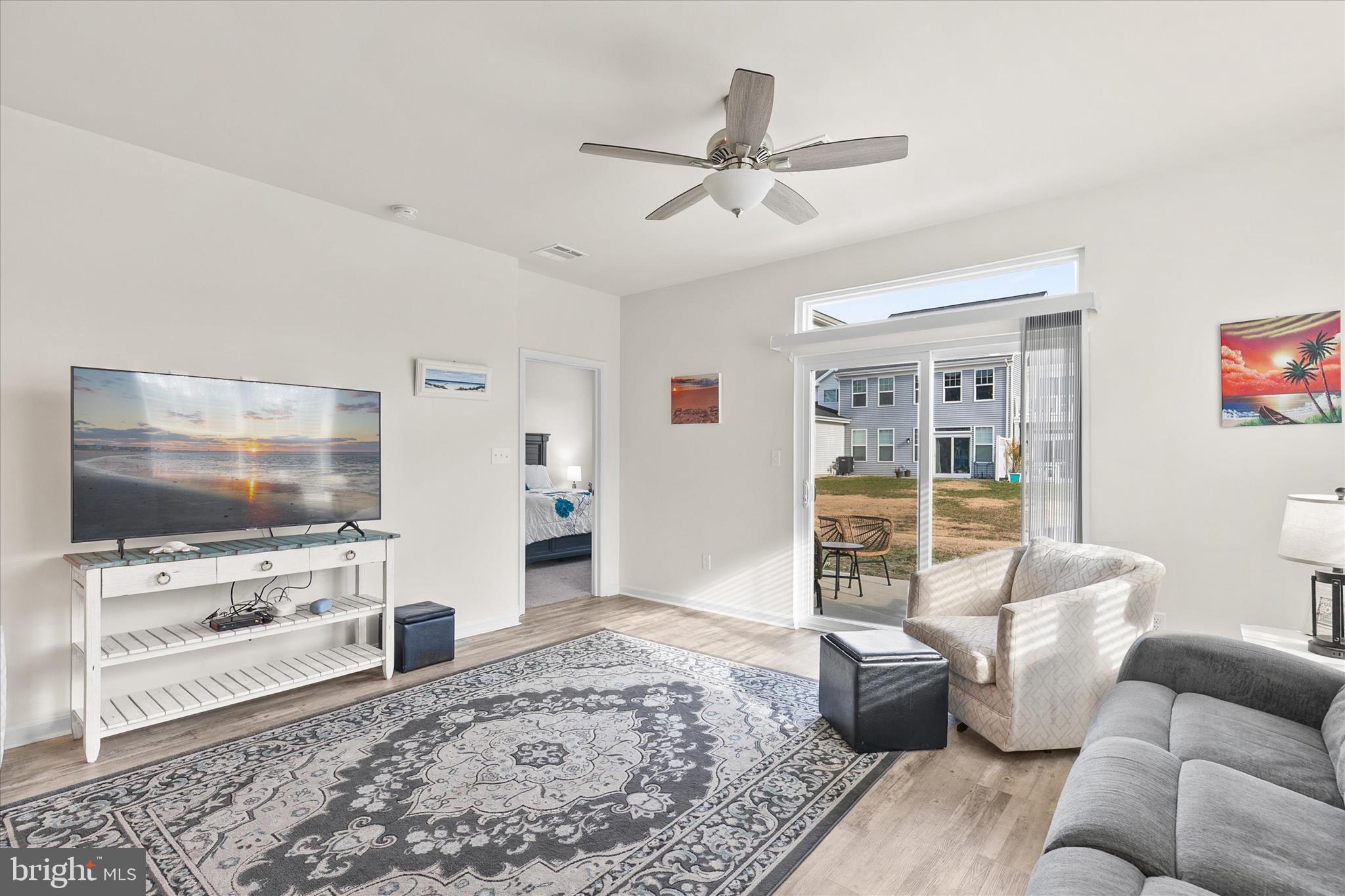 33204 Cross Road Frankford, DE 19945 - Photo 10 of 35 a living room with furniture and a flat screen tv