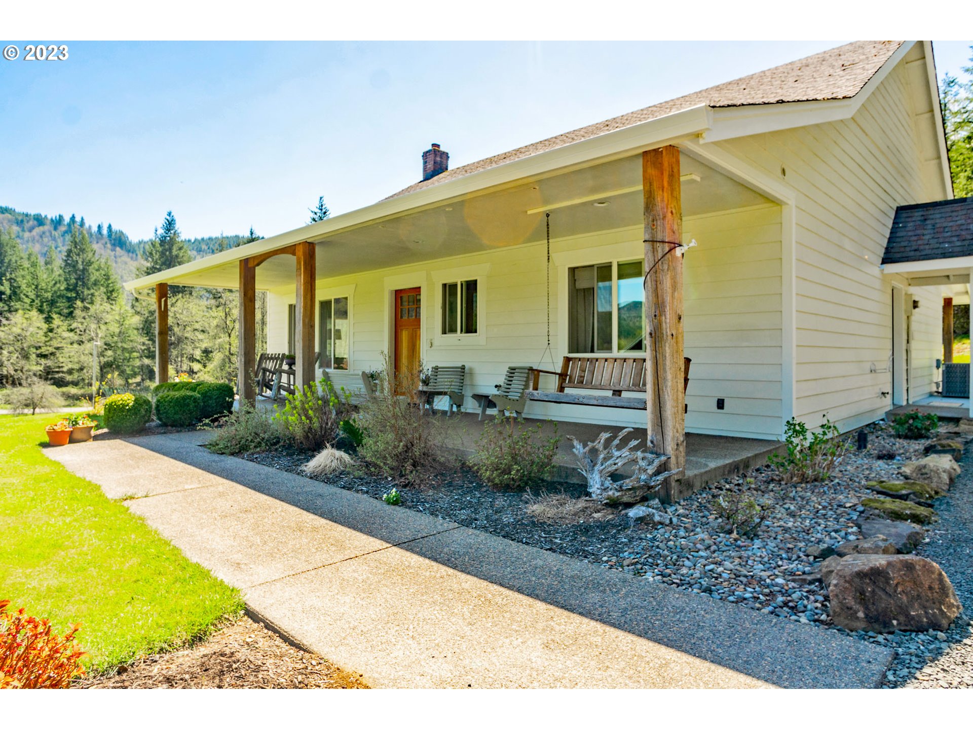 29416 Northeast Healy Road, Unit 2 Amboy, WA 98601 - Photo 1 of 41 a front view of a house with garden