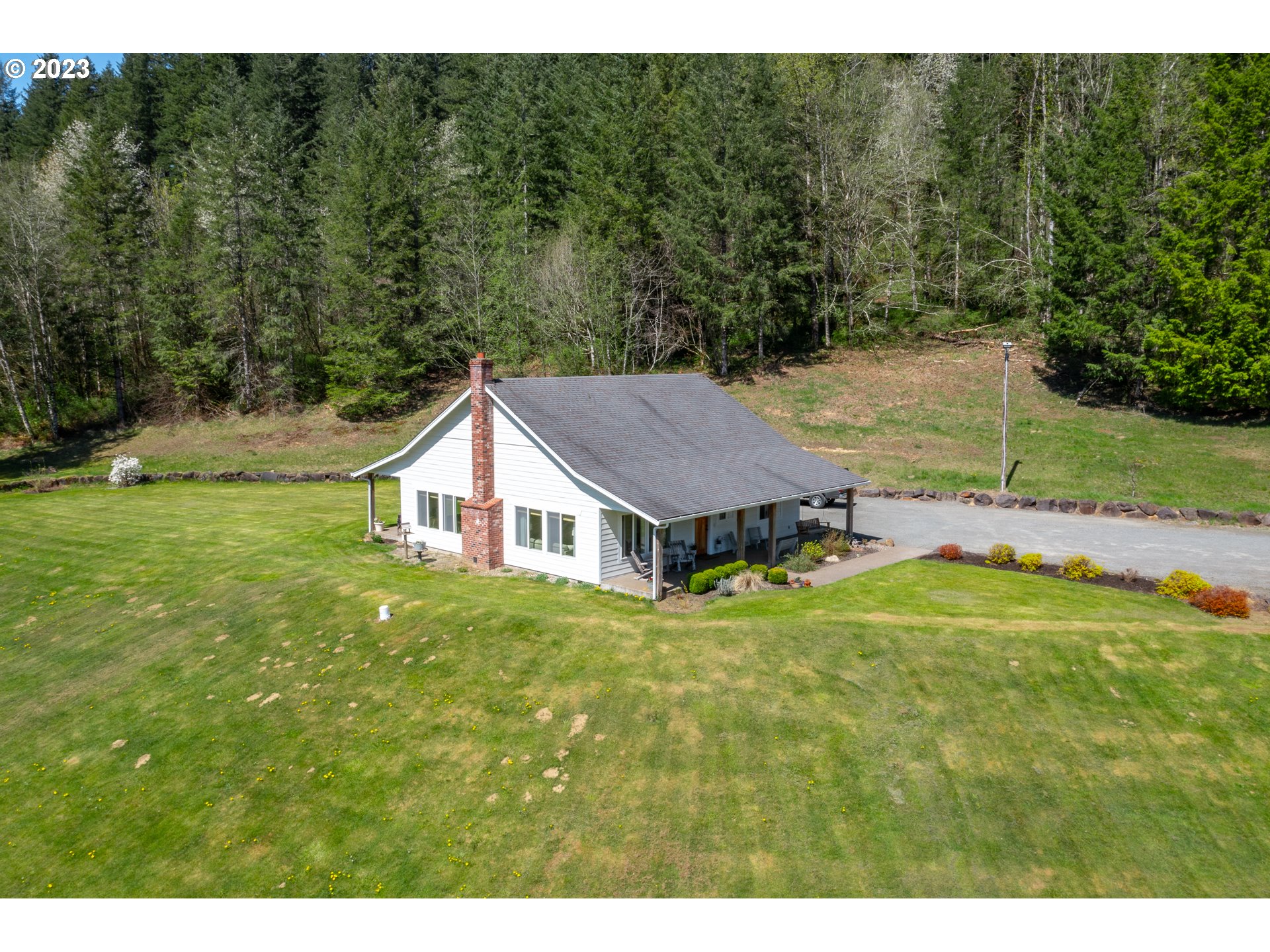 29416 Northeast Healy Road, Unit 2 Amboy, WA 98601 - Photo 2 of 41 a house view with a garden space