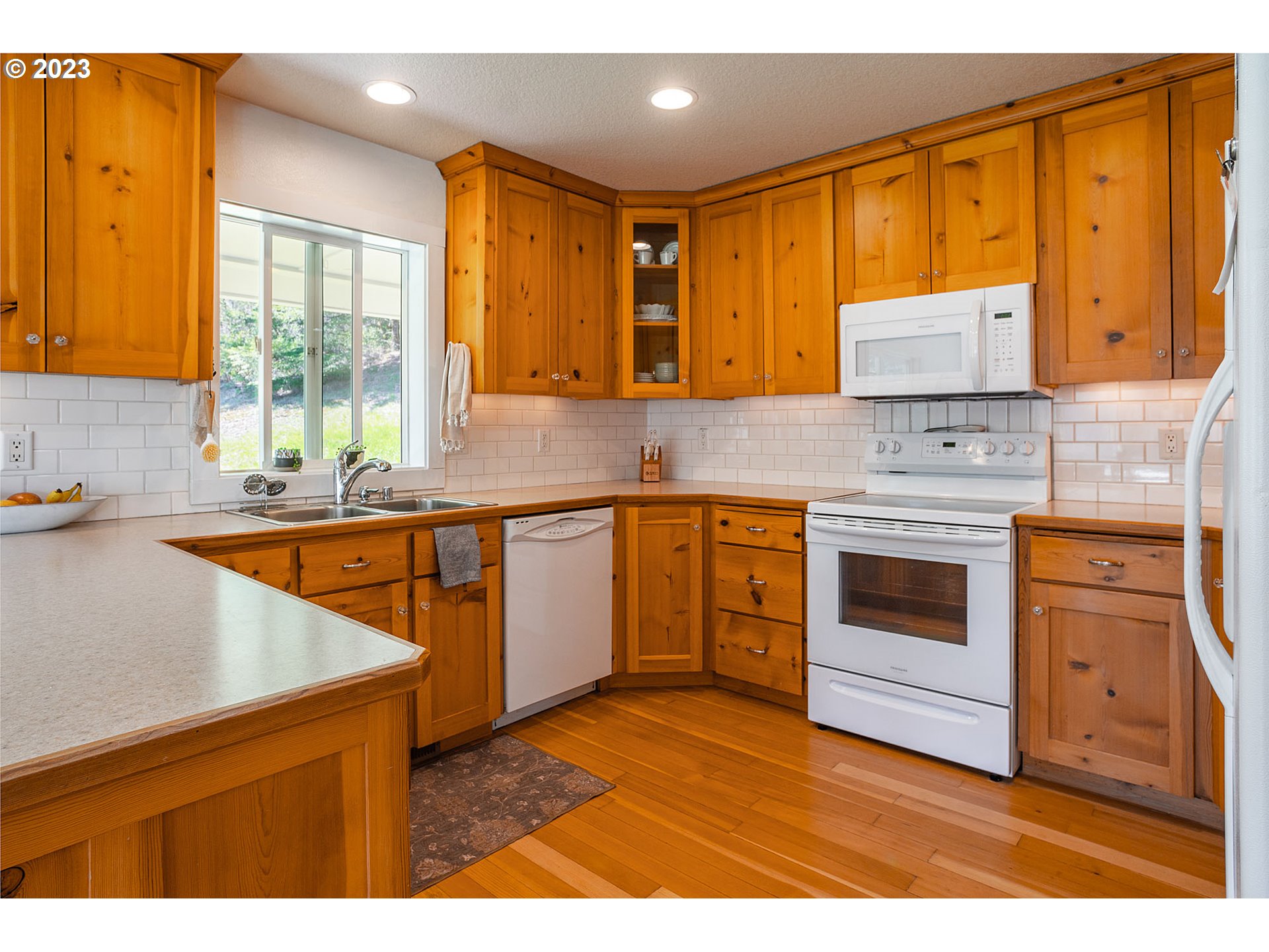 29416 Northeast Healy Road, Unit 2 Amboy, WA 98601 - Photo 21 of 41 a kitchen with a stove a sink and a microwave