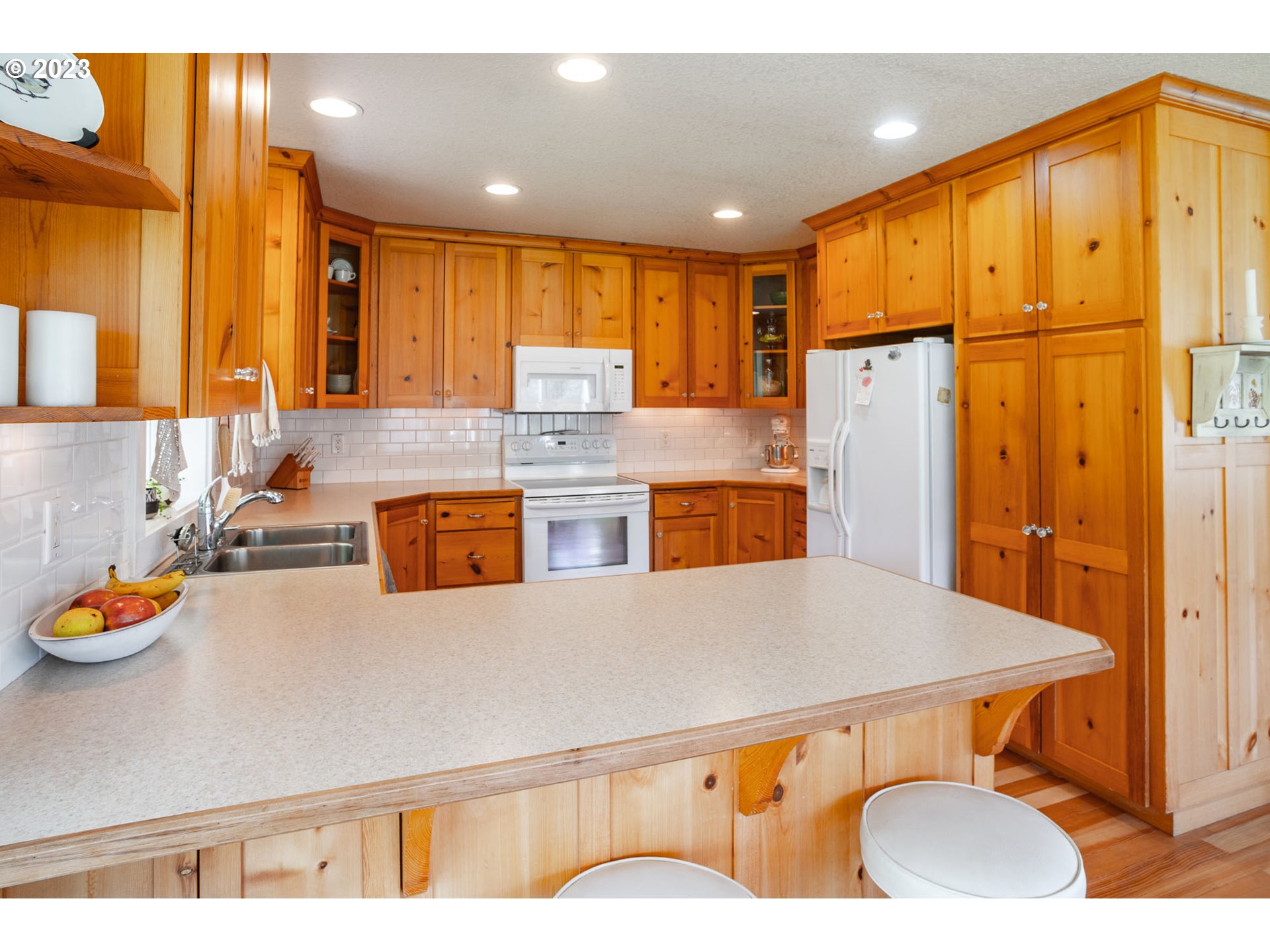 29416 Northeast Healy Road, Unit 2 Amboy, WA 98601 - Photo 23 of 41 a kitchen with stainless steel appliances a refrigerator a sink a stove and wooden floor