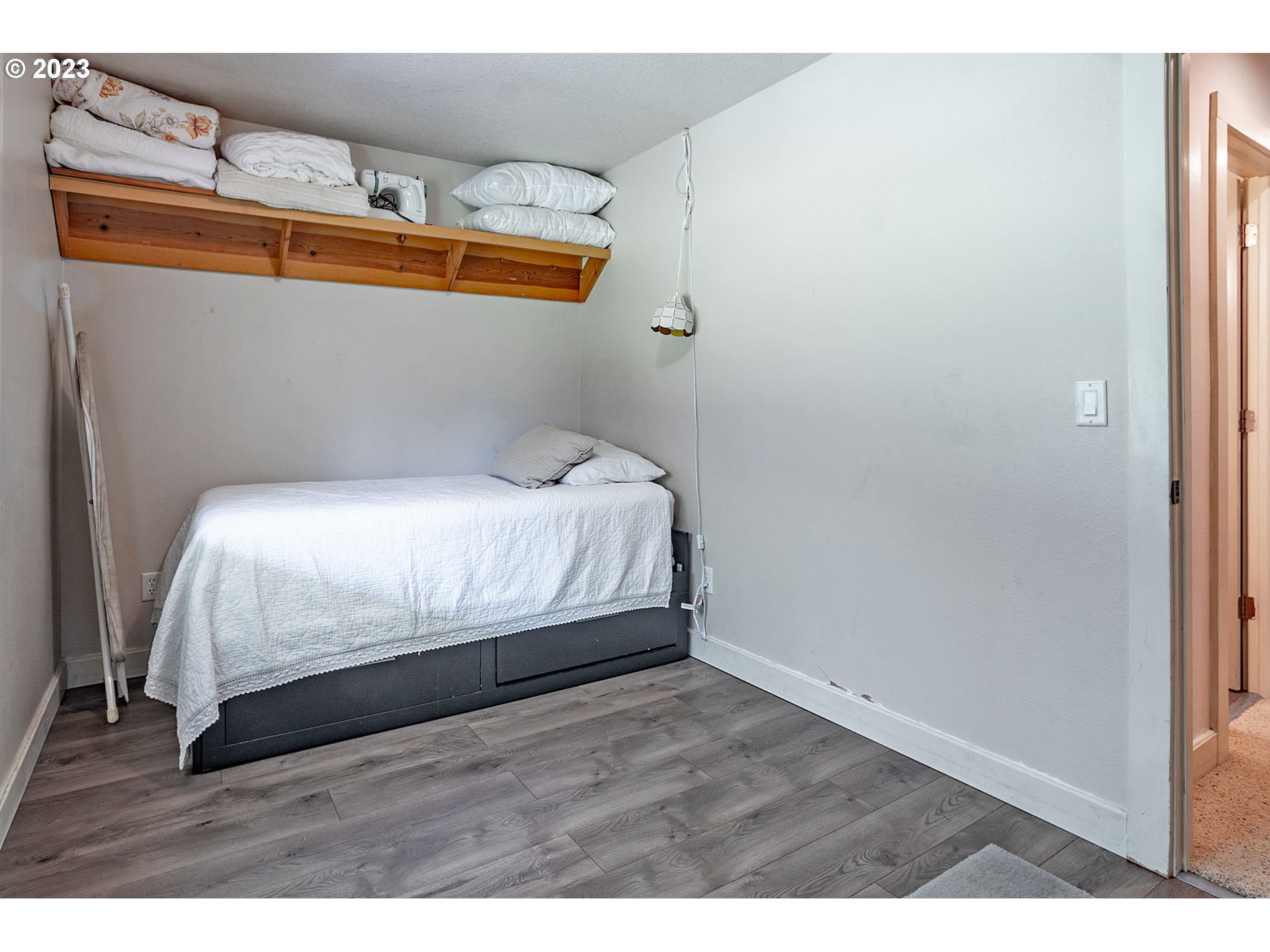 29416 Northeast Healy Road, Unit 2 Amboy, WA 98601 - Photo 28 of 41 a bedroom with a bed and wooden floor