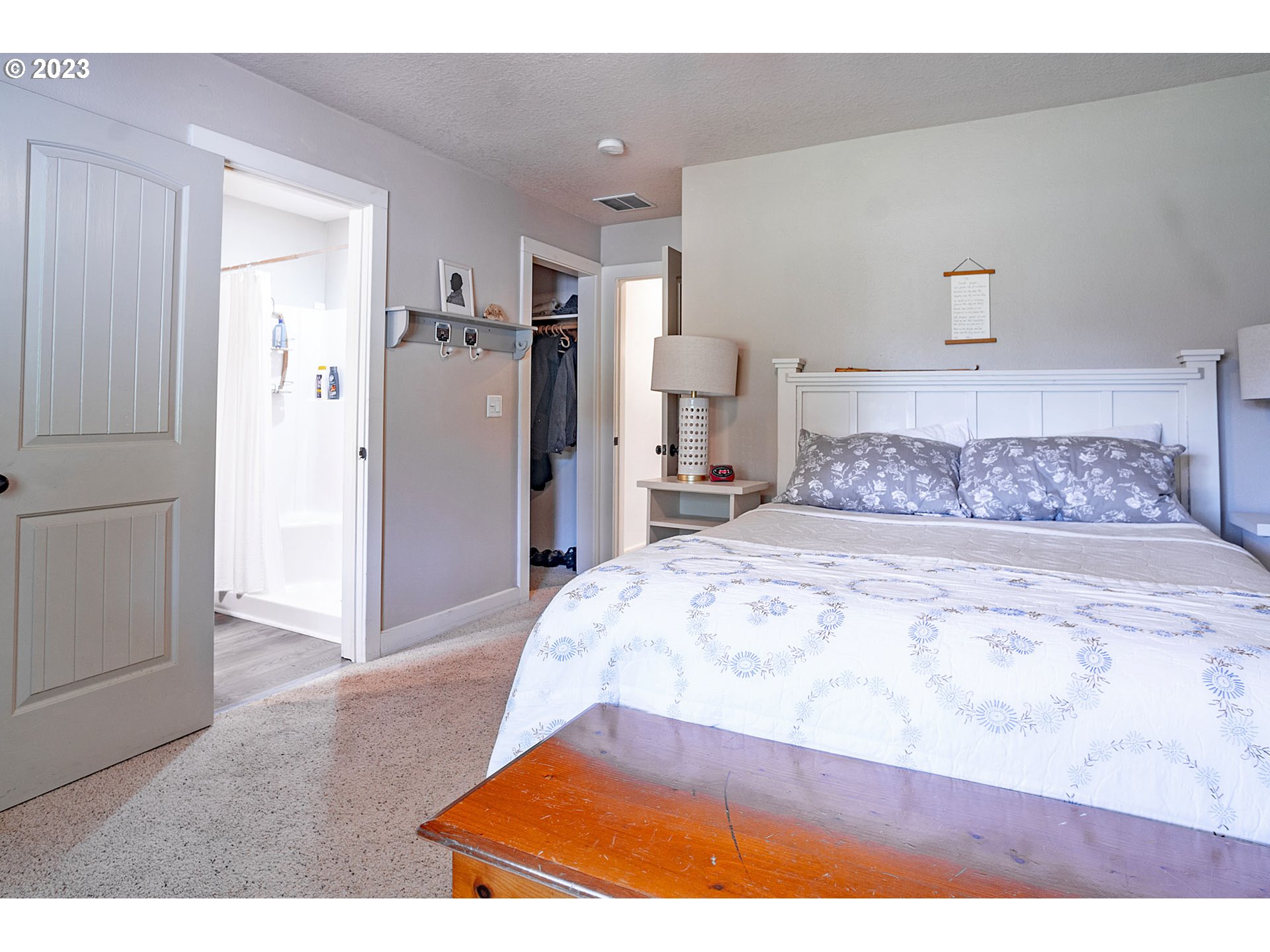 29416 Northeast Healy Road, Unit 2 Amboy, WA 98601 - Photo 30 of 41 a large bedroom with a bed and a table