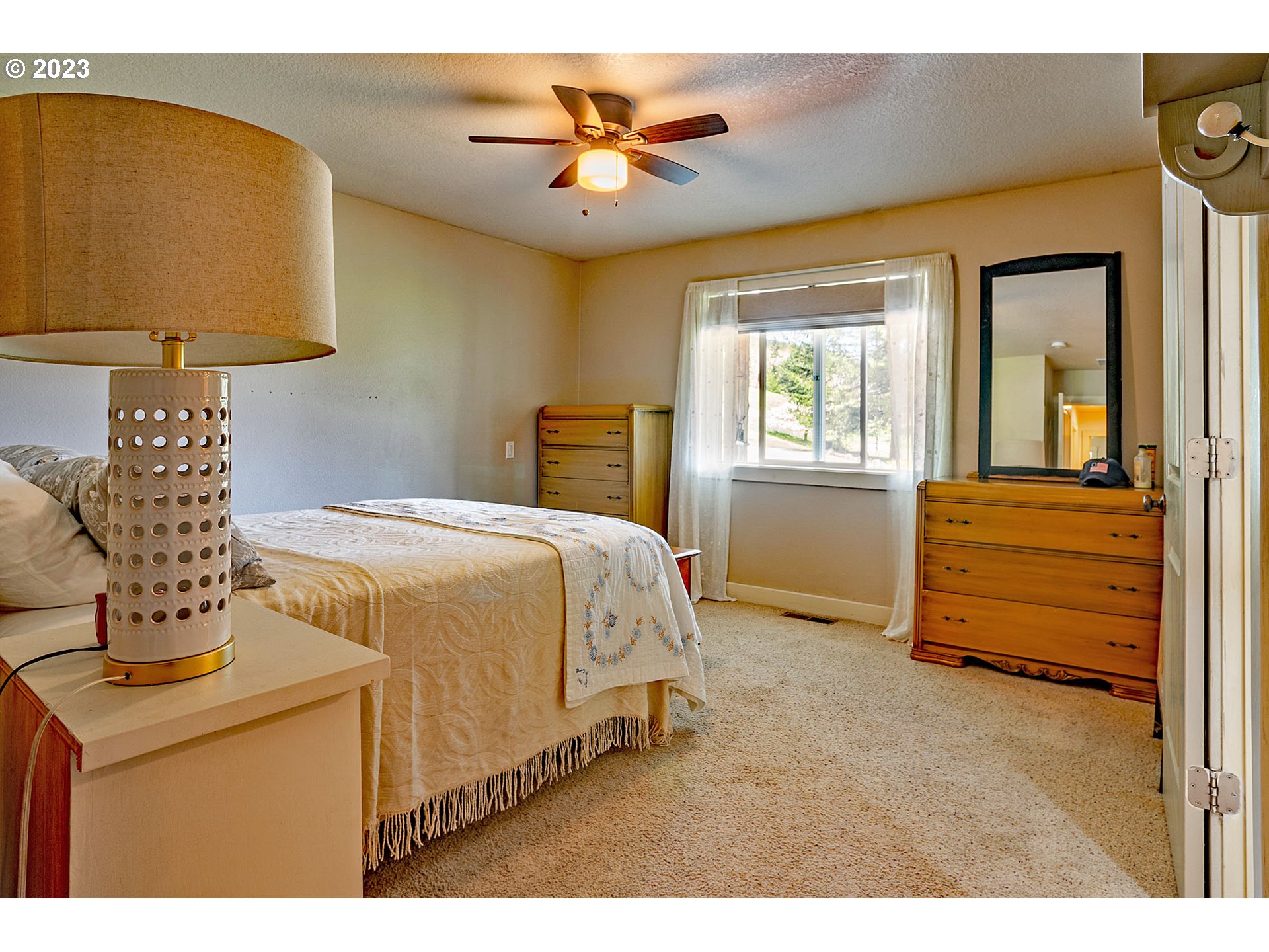 29416 Northeast Healy Road, Unit 2 Amboy, WA 98601 - Photo 32 of 41 a bedroom with a bed and a table in it