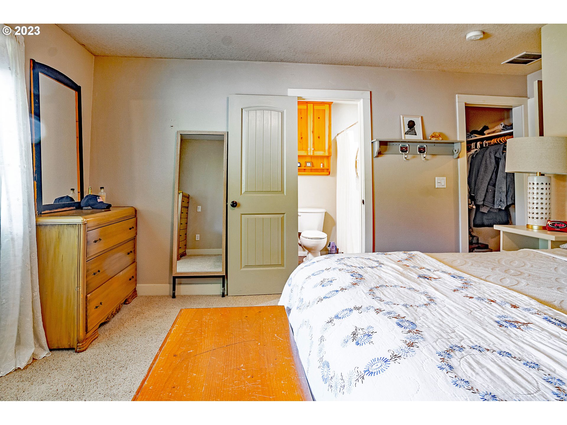 29416 Northeast Healy Road, Unit 2 Amboy, WA 98601 - Photo 34 of 41 a bedroom with a bed and a flat tv screen on dresser
