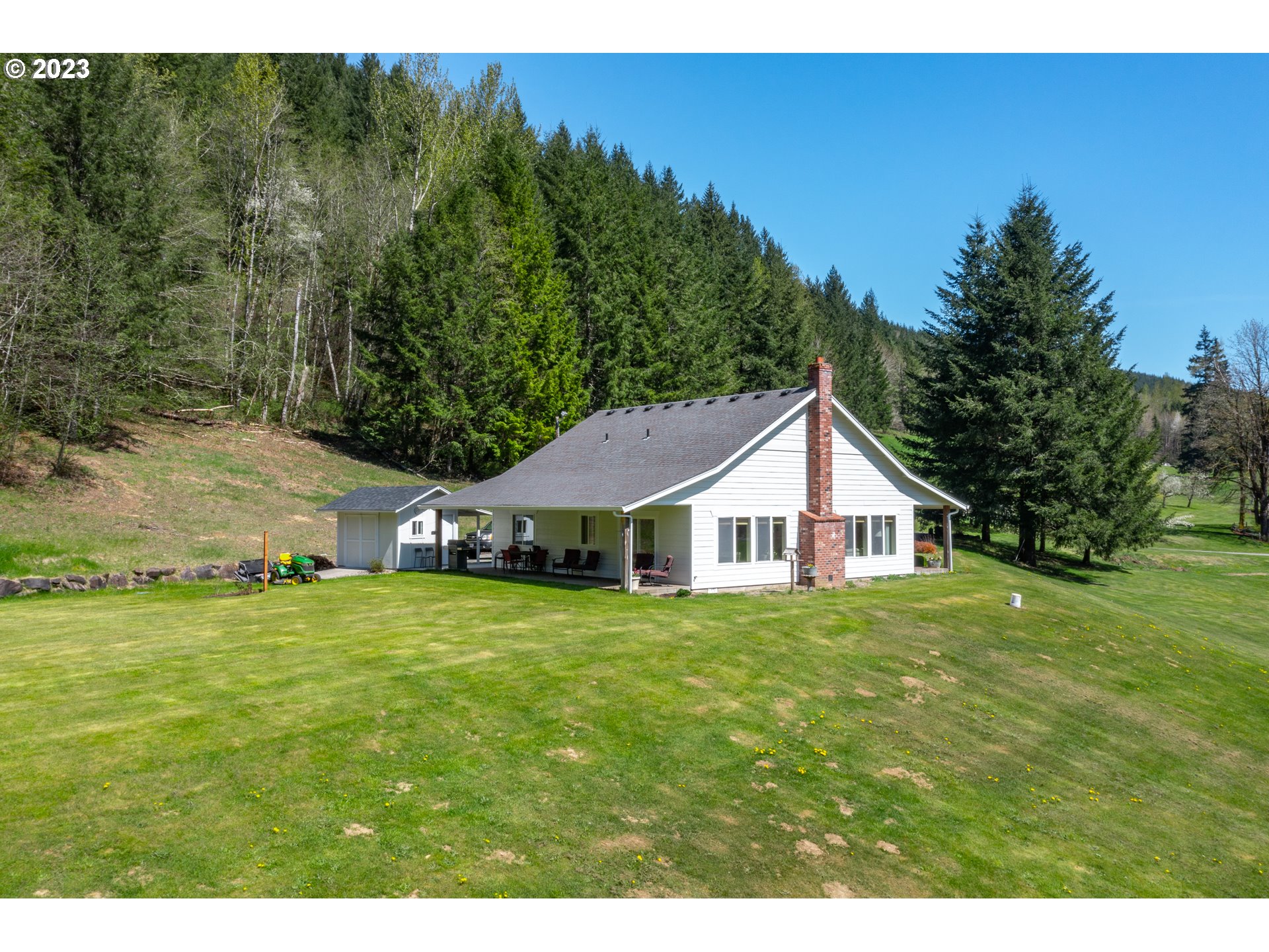 29416 Northeast Healy Road, Unit 2 Amboy, WA 98601 - Photo 4 of 41 a big house with a big yard and large trees