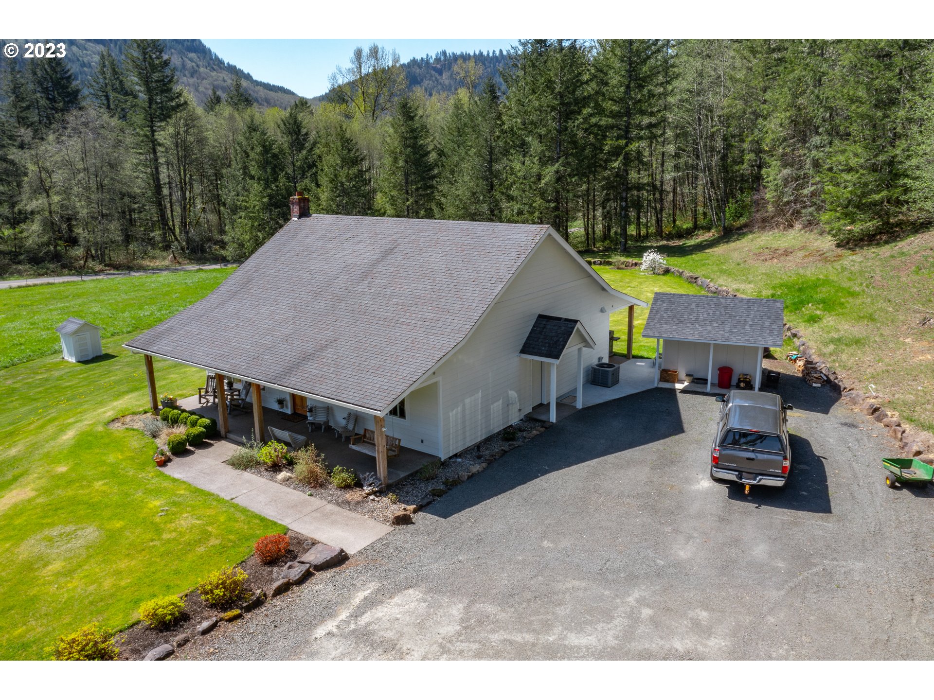 29416 Northeast Healy Road, Unit 2 Amboy, WA 98601 - Photo 6 of 41 a aerial view of a house with table and chairs