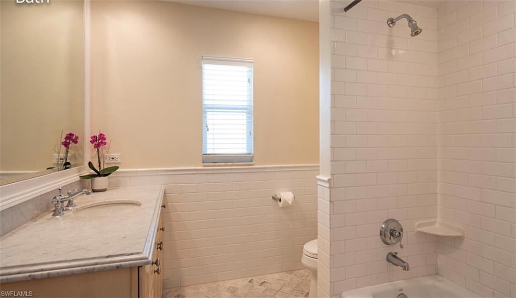 508 Devils Lane Naples, FL 34103 - Photo 11 of 15 a bathroom with a sink and a shower