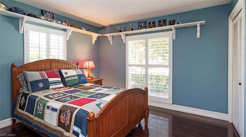 508 Devils Lane Naples, FL 34103 - Photo 12 of 15 a bedroom with a bed and a window