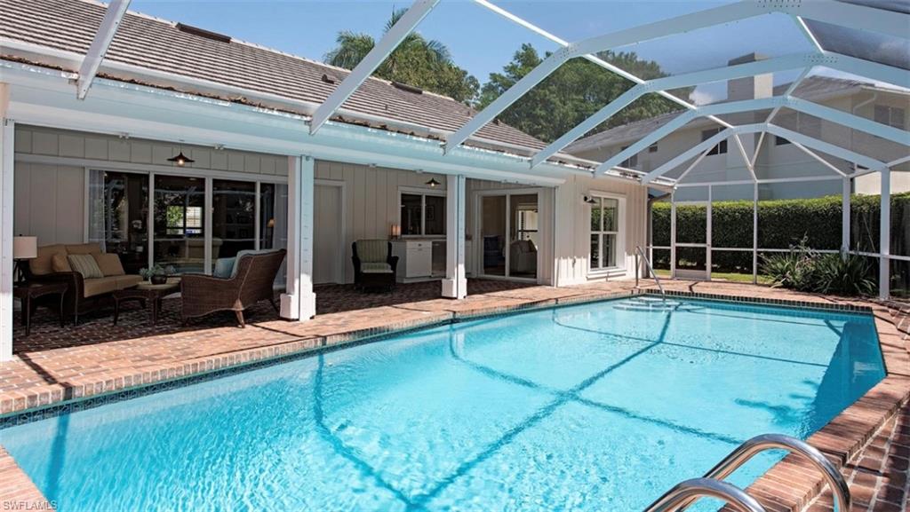 508 Devils Lane Naples, FL 34103 - Photo 13 of 15 a view of a house with backyard and porch