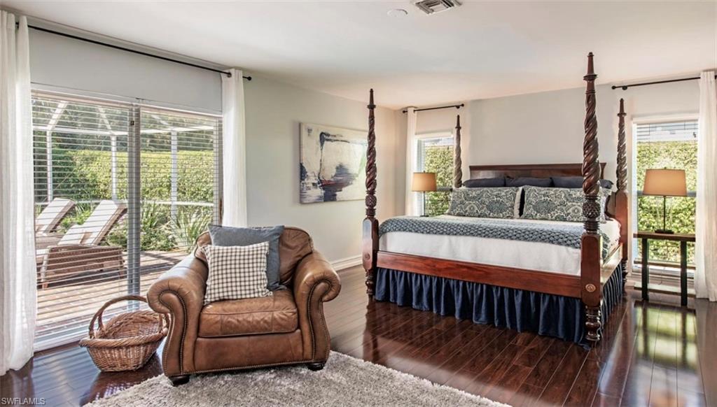 508 Devils Lane Naples, FL 34103 - Photo 8 of 15 a bedroom with furniture and a window
