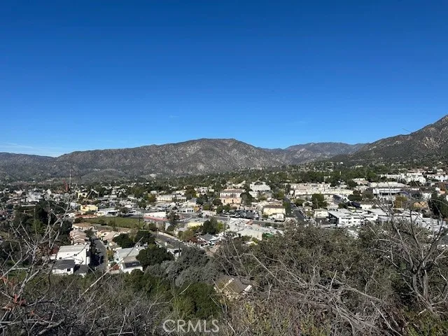 an aerial view of residential house and green space