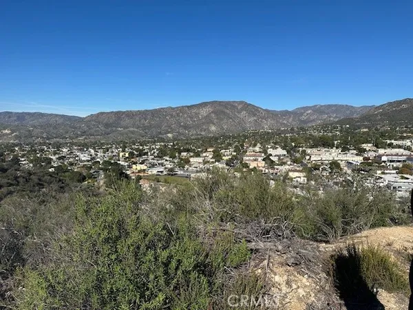 a view of a city with mountains in the background