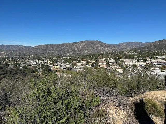 a view of a city with mountains in the background