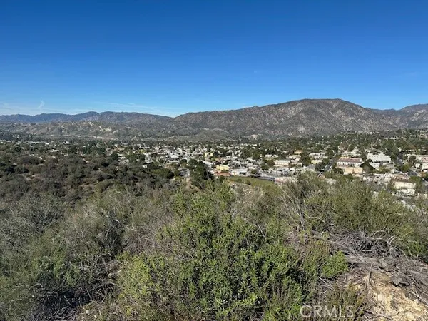 a view of a city with mountains in the background