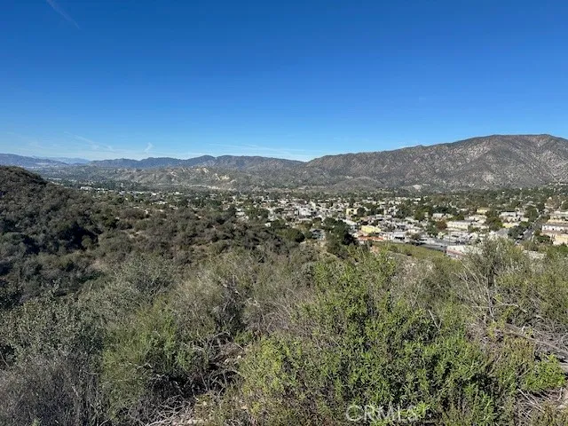 a view of a city with mountains in the background