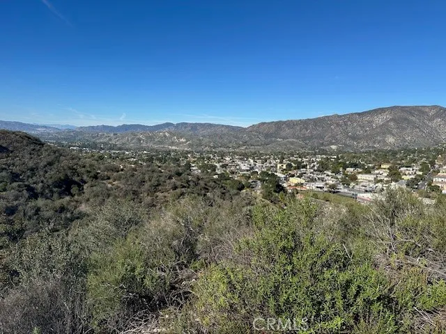 a view of a city with mountains in the background