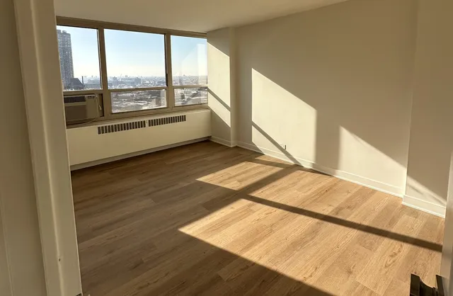 a view of an empty room and window