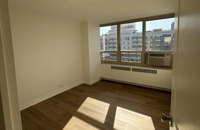 a view of an empty room with a window