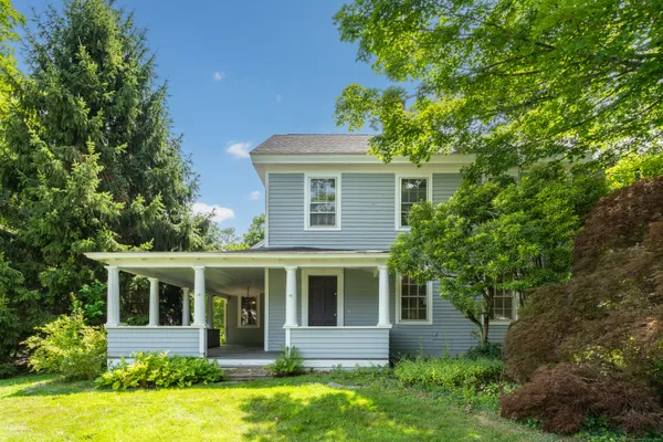 front view of a house with a yard