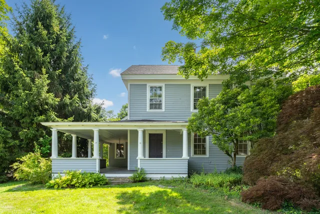 front view of a house with a yard