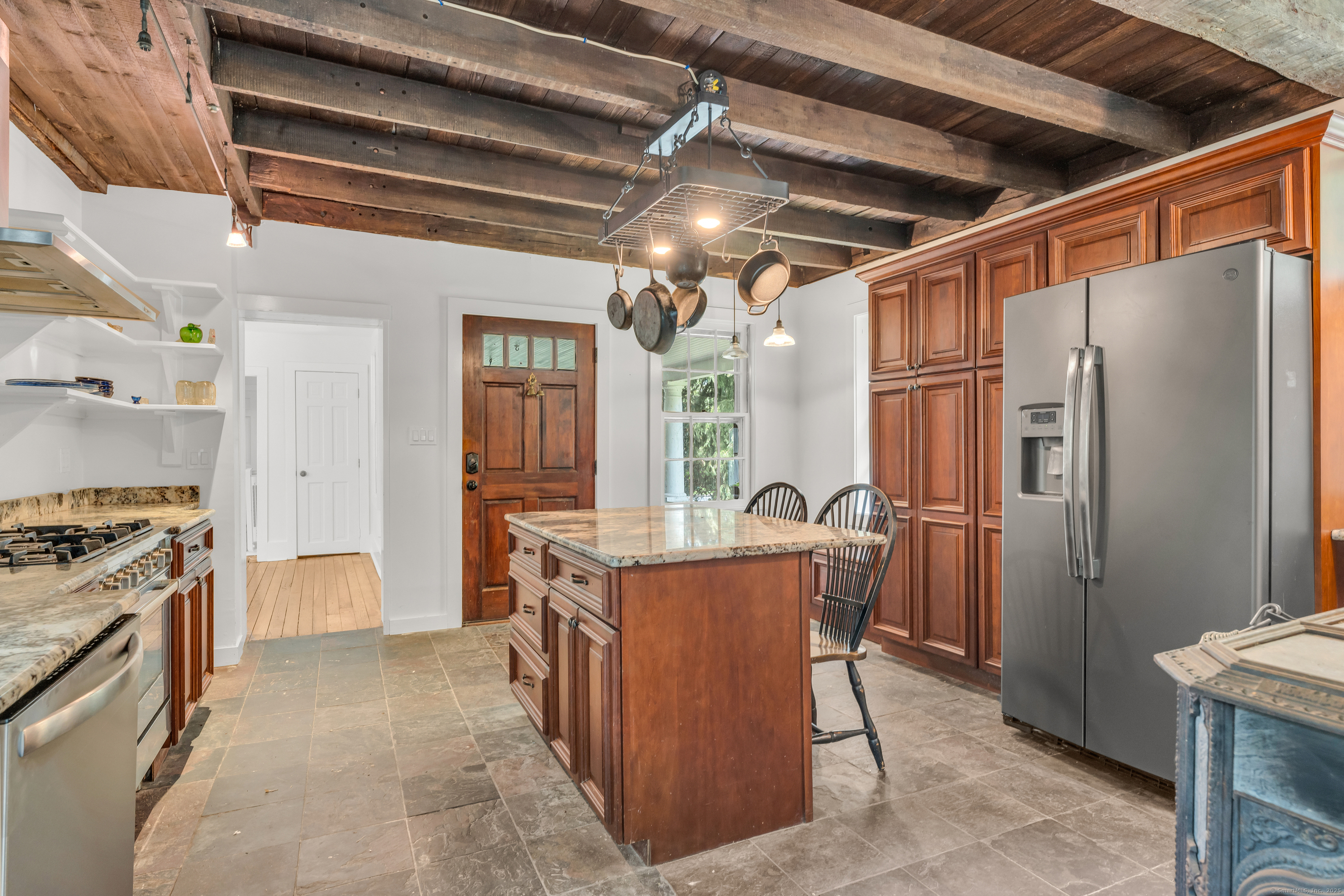 108 Boston Post Road Madison, CT 06443 - Photo 11 of 27 a open kitchen with stainless steel appliances granite countertop a stove and a refrigerator