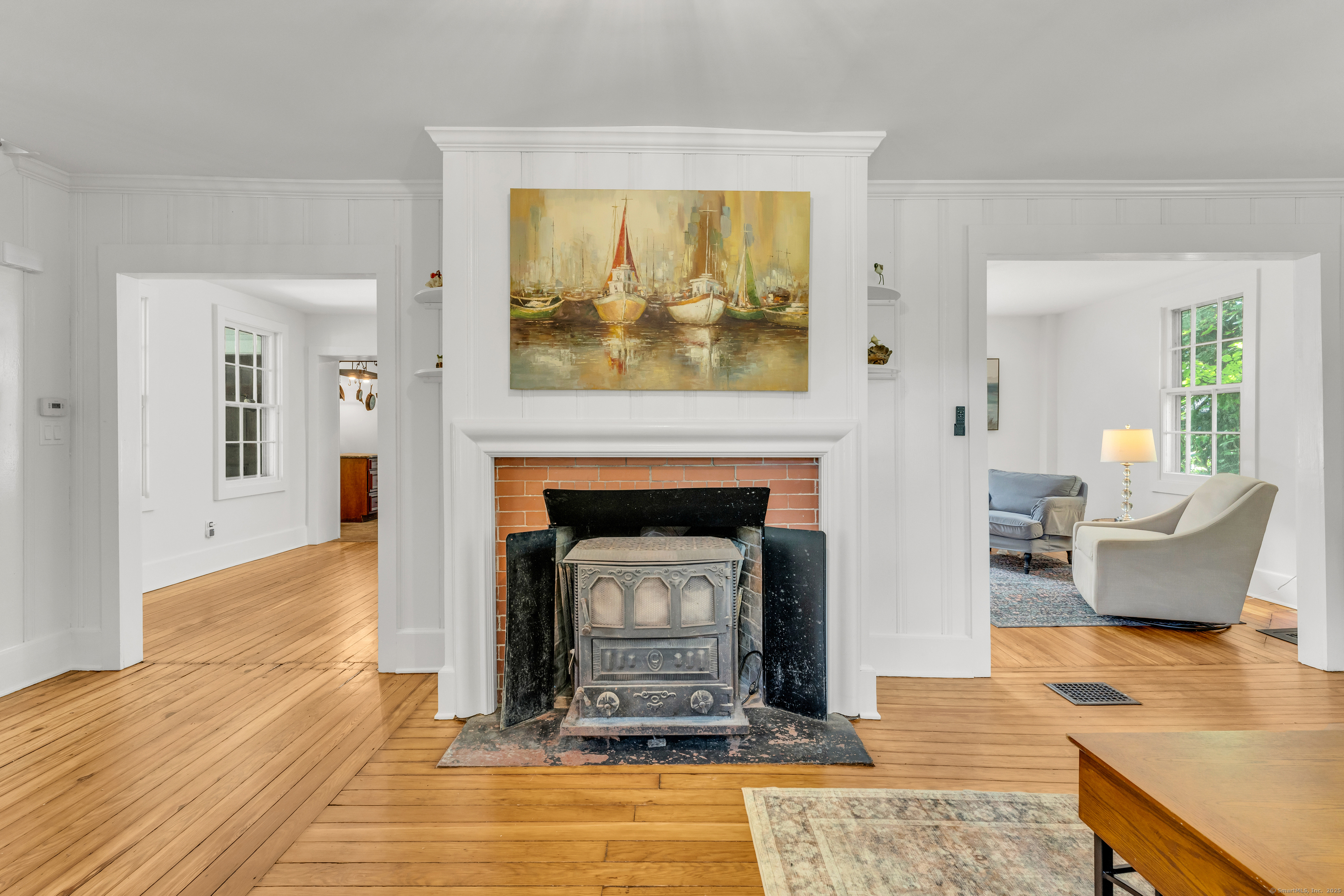 108 Boston Post Road Madison, CT 06443 - Photo 14 of 27 a living room with furniture and a fireplace