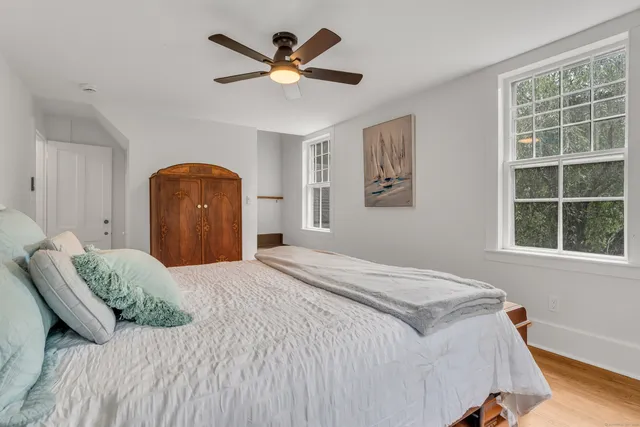 a livingroom with furniture window and wooden floor