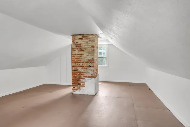 a view of a porch with wooden floor