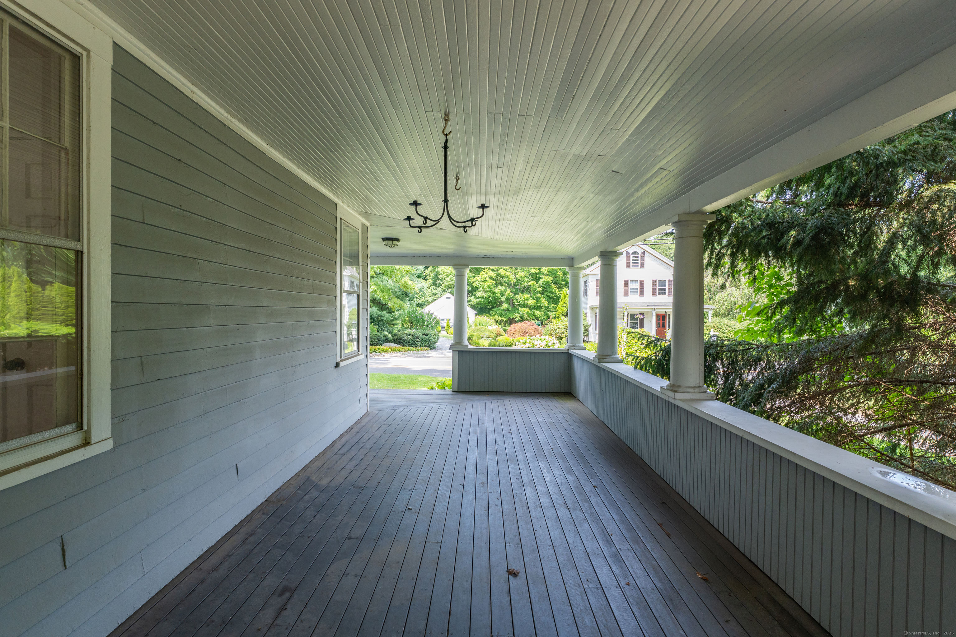 108 Boston Post Road Madison, CT 06443 - Photo 20 of 27 a view of a porch with wooden floor