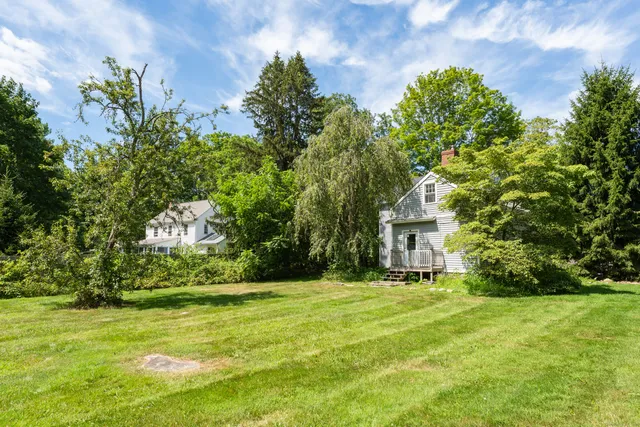 a view of a swimming pool with a yard