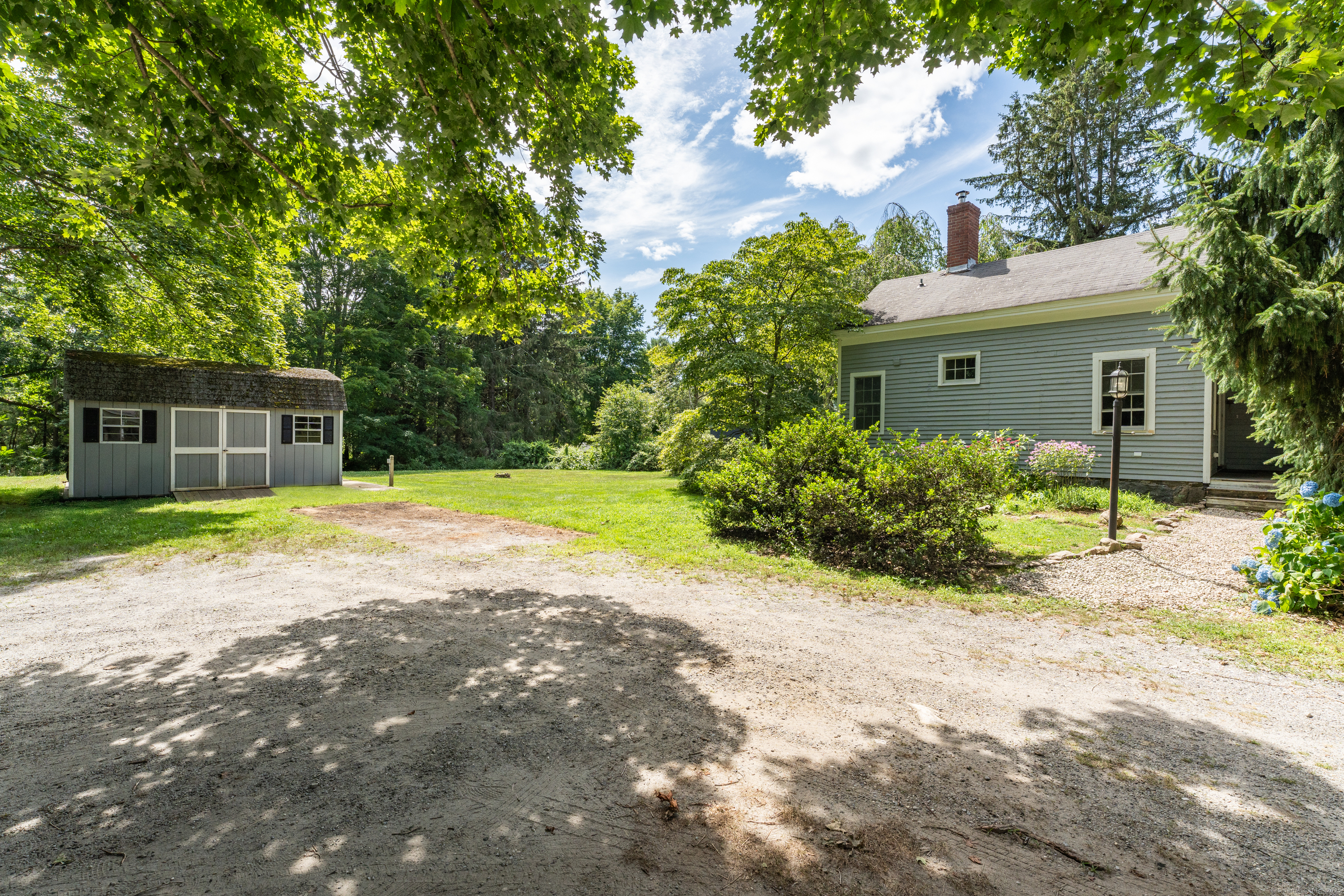 108 Boston Post Road Madison, CT 06443 - Photo 25 of 27 a house with a swimming pool