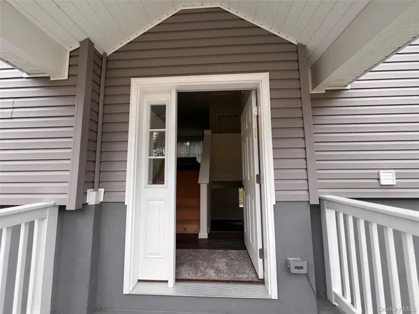 a view of porch with a door