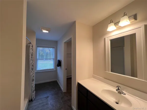a bathroom with a sink double vanity and a mirror