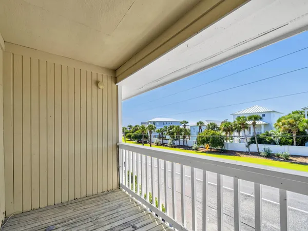 a view of a porch and wooden floor
