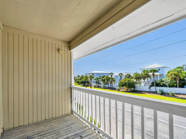 a view of a porch and wooden floor