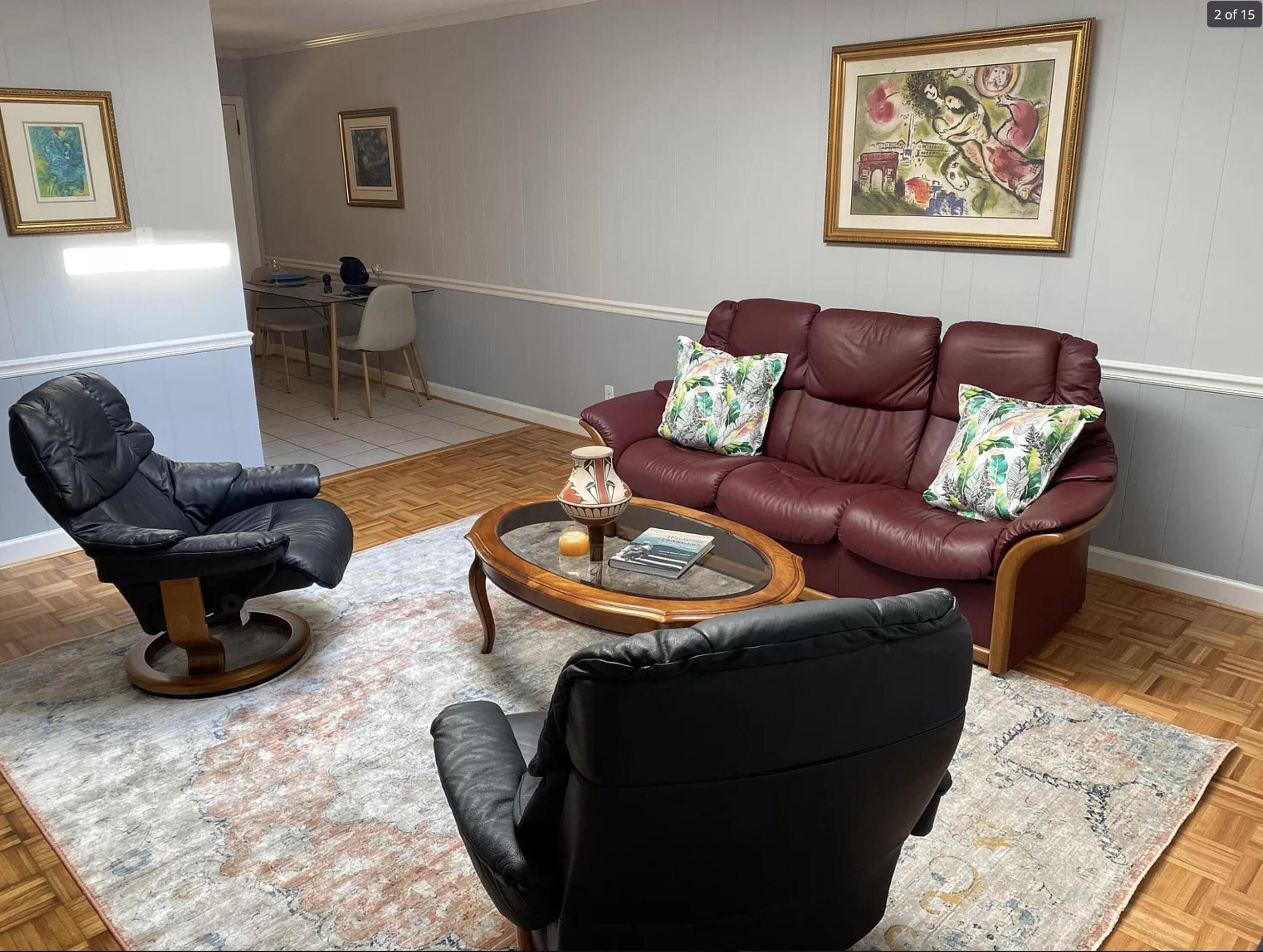 1416 Old Lystra Road, Unit 2 Chapel Hill, NC 27517 - Photo 3 of 11 a living room with furniture a rug and a lamp